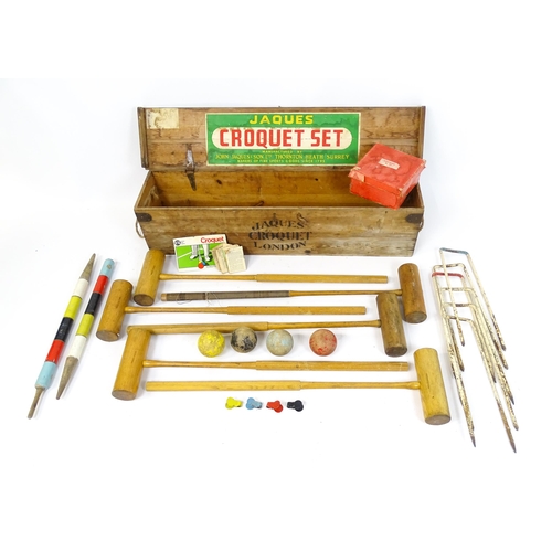 1189 - Toys: A boxed Jacques croquet set to include mallets, balls, hoops, centre peg, etc. Box approx. 42