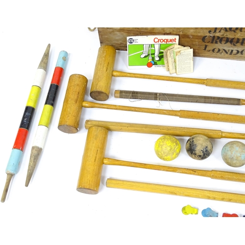 1189 - Toys: A boxed Jacques croquet set to include mallets, balls, hoops, centre peg, etc. Box approx. 42