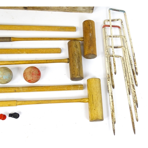 1189 - Toys: A boxed Jacques croquet set to include mallets, balls, hoops, centre peg, etc. Box approx. 42