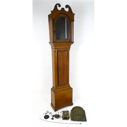 1645 - A late 18thC / early 20thC oak cased long case clock with brass break arch dial signed John Skinner ... 