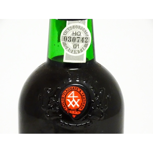 1144A - A 75cl bottle of 1986 Taylor's late bottled vintage port.