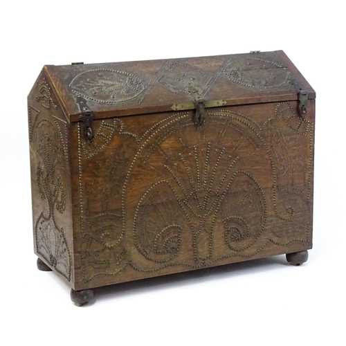 1751 - A large late 19thC Anglo-Indian oak casket / dowry chest with brass stud detailing depicting peacock... 