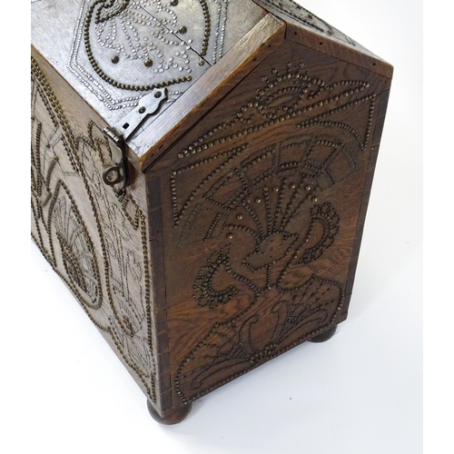 1751 - A large late 19thC Anglo-Indian oak casket / dowry chest with brass stud detailing depicting peacock... 