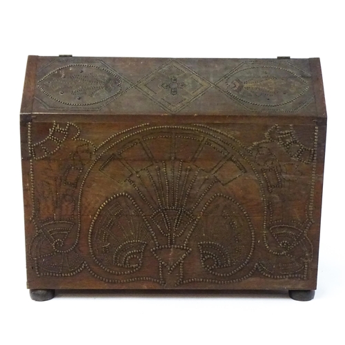 1751 - A large late 19thC Anglo-Indian oak casket / dowry chest with brass stud detailing depicting peacock... 