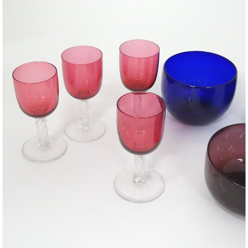 782 - A quantity of assorted glassware to include Bristol blue glass coloured rinser, amethyst rinser, and... 