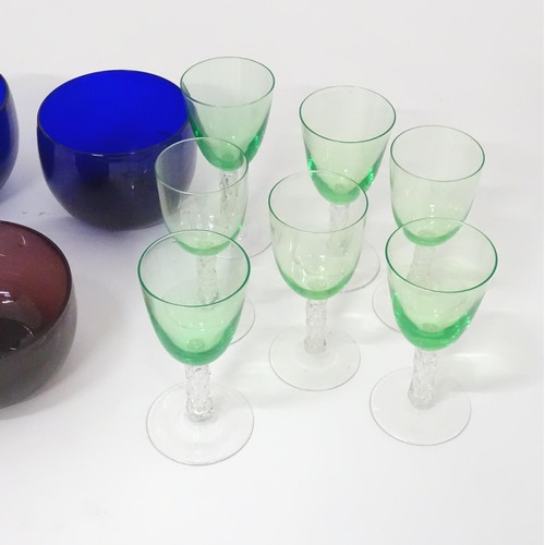 782 - A quantity of assorted glassware to include Bristol blue glass coloured rinser, amethyst rinser, and... 