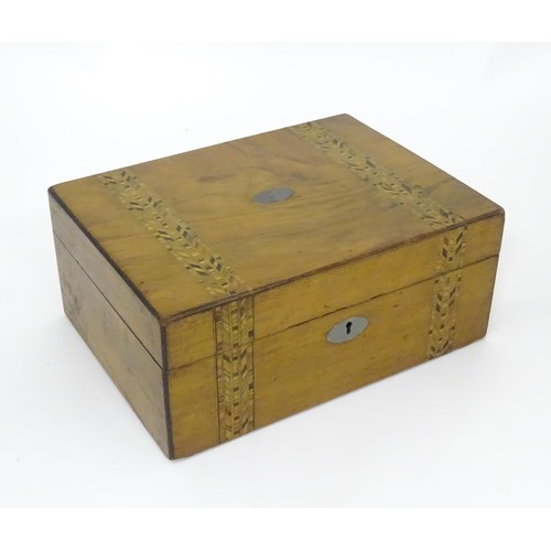 788 - A 19thC walnut work box with decorative inlaid bands in the style of Tunbridgeware, containing a qua... 