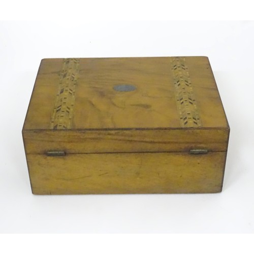 788 - A 19thC walnut work box with decorative inlaid bands in the style of Tunbridgeware, containing a qua... 