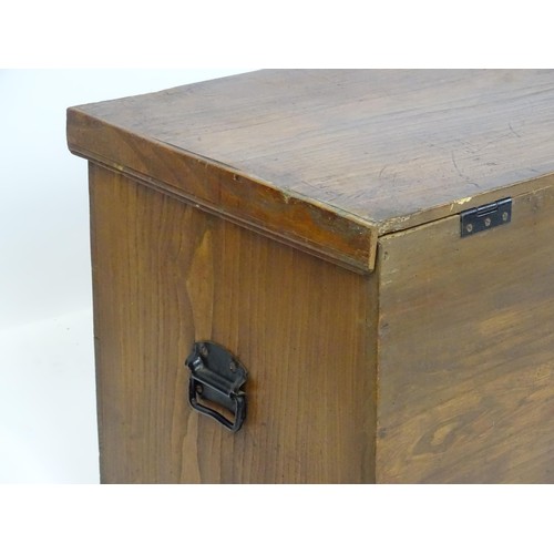 842 - An early to mid 20thC elm trunk with cast handles and paper lined interior. Approx 38