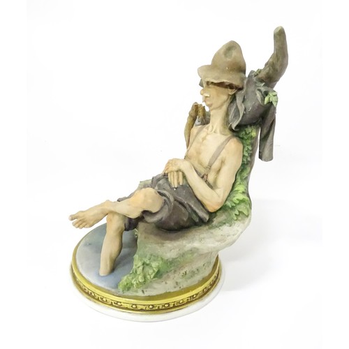 863 - A Capodimonte figure modelled as a sleeping fisherman, designed by Giuseppe Cappe. Approx. 9 3/4