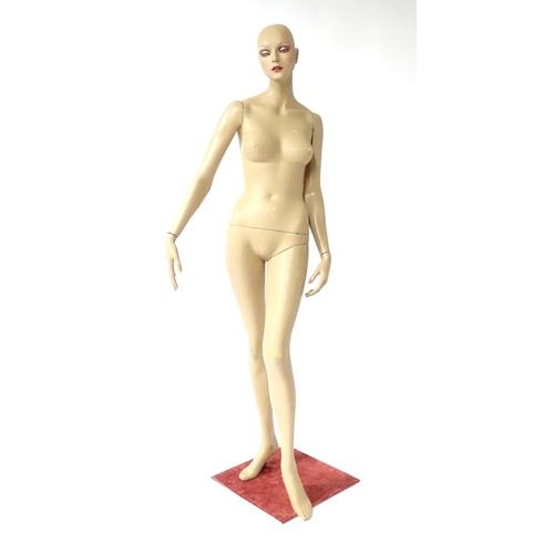 875 - A late 20th-early 21stC female mannequin / shop display dummy , with semi-articulated and separable ... 