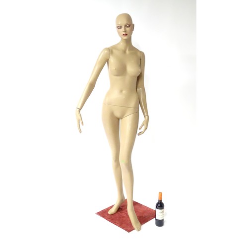 875 - A late 20th-early 21stC female mannequin / shop display dummy , with semi-articulated and separable ... 