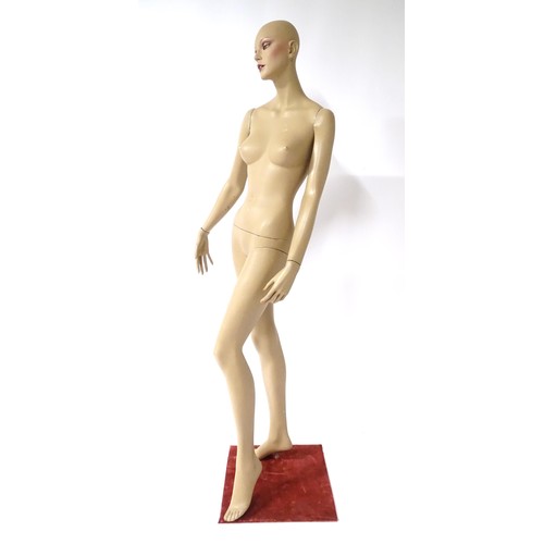 875 - A late 20th-early 21stC female mannequin / shop display dummy , with semi-articulated and separable ... 