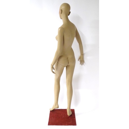 875 - A late 20th-early 21stC female mannequin / shop display dummy , with semi-articulated and separable ... 