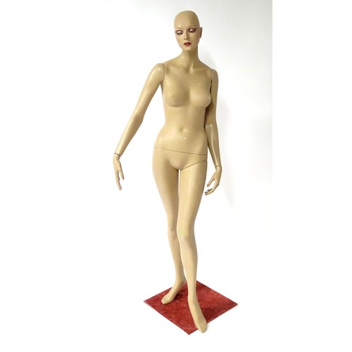 875 - A late 20th-early 21stC female mannequin / shop display dummy , with semi-articulated and separable ... 