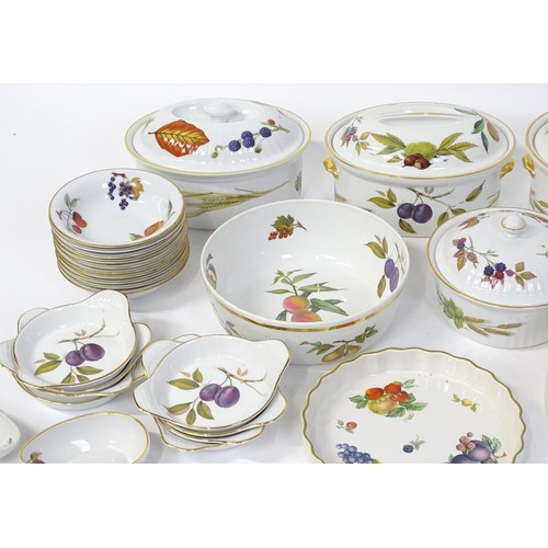 876 - A large quantity of Royal Worcester dinner wares in the Evesham pattern to include plates, tureens, ... 