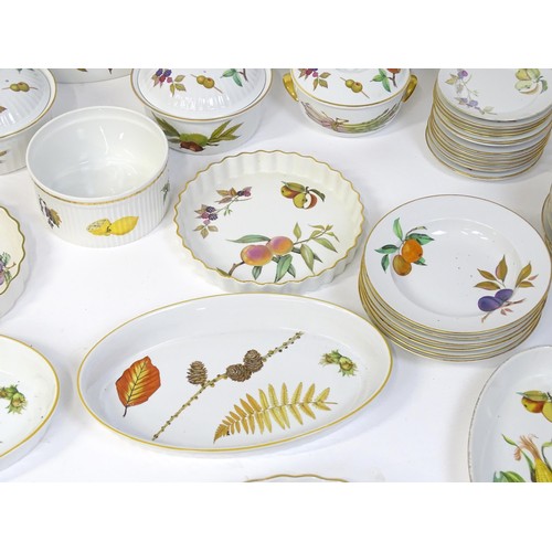 876 - A large quantity of Royal Worcester dinner wares in the Evesham pattern to include plates, tureens, ... 