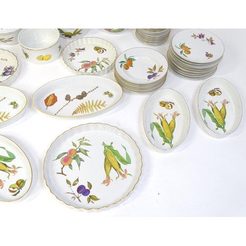 876 - A large quantity of Royal Worcester dinner wares in the Evesham pattern to include plates, tureens, ... 