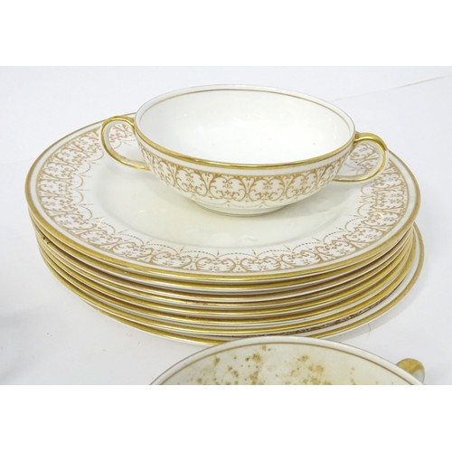 878 - A quantity of Crown Staffordshire dinner wares with gilt borders to include tureens, serving plates,... 