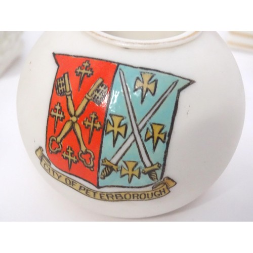 879 - A quantity of crested ware, to include Aylesbury, Norwich, London, Burton-on-Trent, Worcester, Peter... 