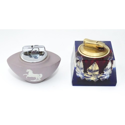 903 - A Wedgwood jasperware table lighter, together with Colibri example, the largest 2 3/4