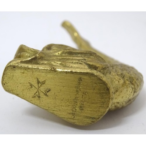 907 - A 20thC brass door knocker of fish form. Together with a coat hook with lion mask detail. Hook appro... 