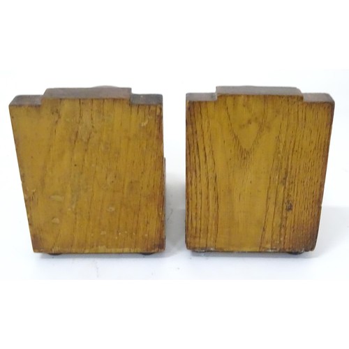 909 - A pair of c1930s oak bookends formed as cricket balls, each approx 4 1/2