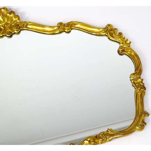 929 - Two modern gilt framed mirrors. The larger measuring 54