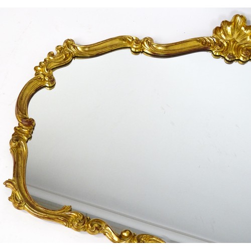 929 - Two modern gilt framed mirrors. The larger measuring 54