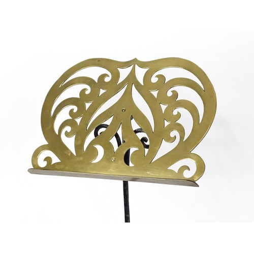 1578 - A Victorian music stand, the brass page rest formed as a lyre and supported by a painted wrought iro... 