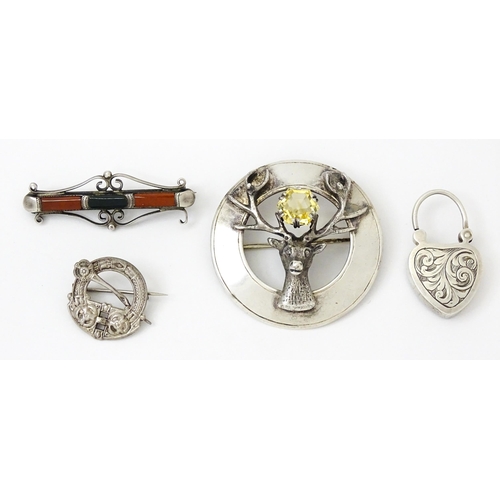 973 - Four items of Scottish jewellery to include a silver brooch with stag detail hallmarked Edinburgh 19... 