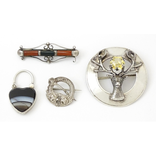 973 - Four items of Scottish jewellery to include a silver brooch with stag detail hallmarked Edinburgh 19... 