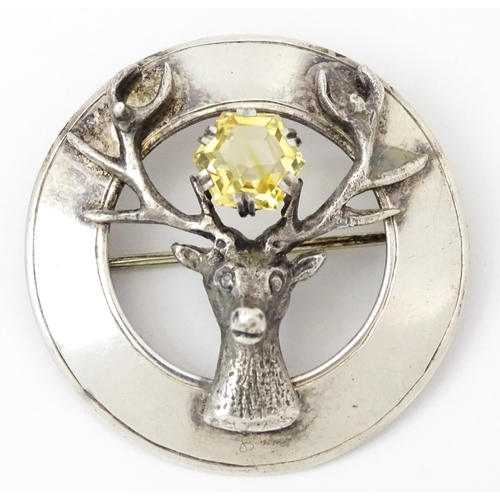 973 - Four items of Scottish jewellery to include a silver brooch with stag detail hallmarked Edinburgh 19... 