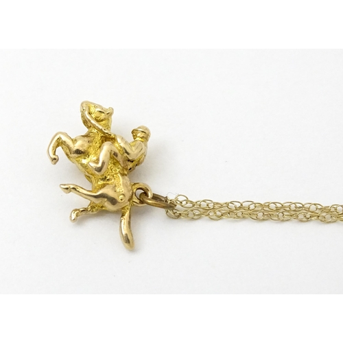 979 - A 9ct gold chain necklace set with 9ct gold pendant formed as a jockey on horse. Pendant approx. 5/8... 