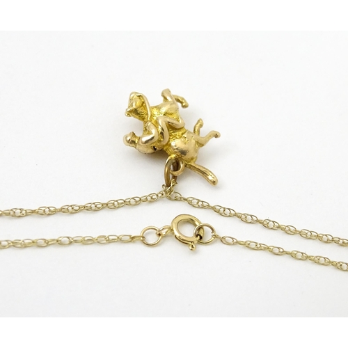 979 - A 9ct gold chain necklace set with 9ct gold pendant formed as a jockey on horse. Pendant approx. 5/8... 