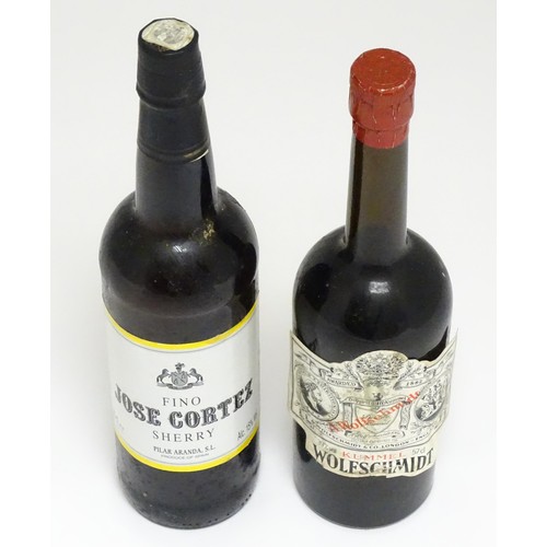 1148A - A 75cl bottle of Jose Cortez sherry, together with a 57cl bottle of Wolfschmidt kummel (2)