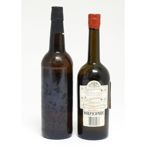 1148A - A 75cl bottle of Jose Cortez sherry, together with a 57cl bottle of Wolfschmidt kummel (2)