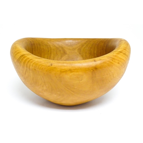 1409 - Treen : A 20thC carved wooden bowl oval form, stamped Caton under, possibly by Paul Caton. Approx. 1... 