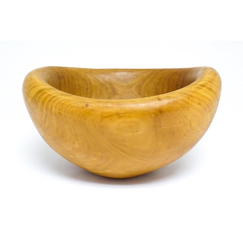 1409 - Treen : A 20thC carved wooden bowl oval form, stamped Caton under, possibly by Paul Caton. Approx. 1... 