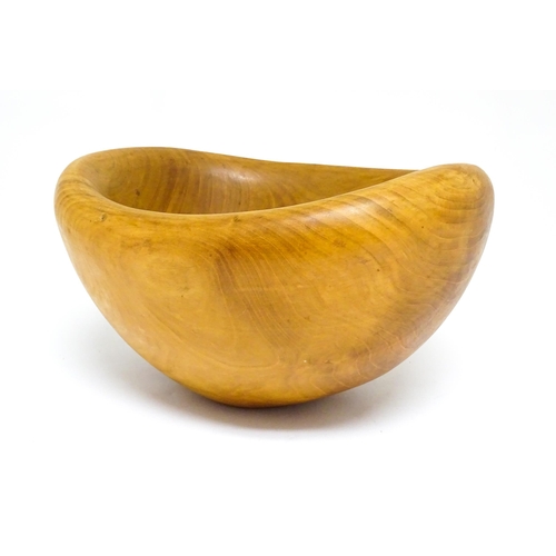 1409 - Treen : A 20thC carved wooden bowl oval form, stamped Caton under, possibly by Paul Caton. Approx. 1... 