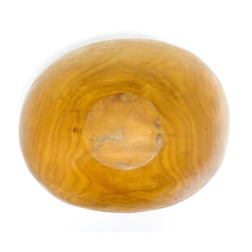 1409 - Treen : A 20thC carved wooden bowl oval form, stamped Caton under, possibly by Paul Caton. Approx. 1... 