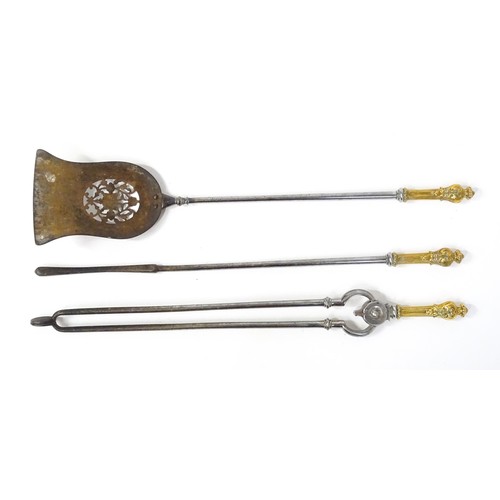 1587A - A 19th set of fire tools, comprising shovel, poker and tongs, each with polished wrought iron shafts... 