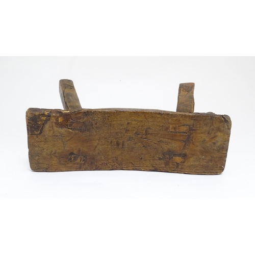 1739 - A 19thC oak country made small milking stool, the seat of rectangular form supported by four splayed... 