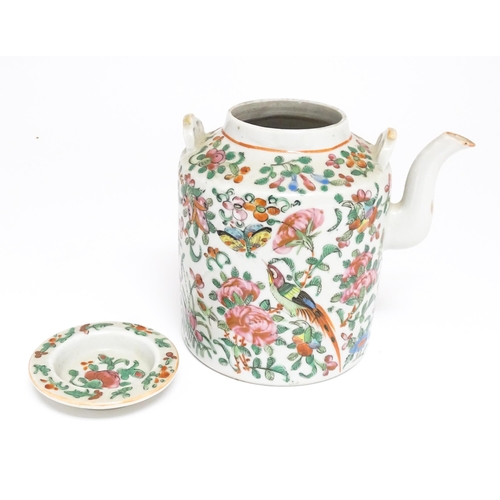 37A - A Chinese Cantonese famille rose teapot decorated with flowers, foliage, birds and butterflies. Appr... 