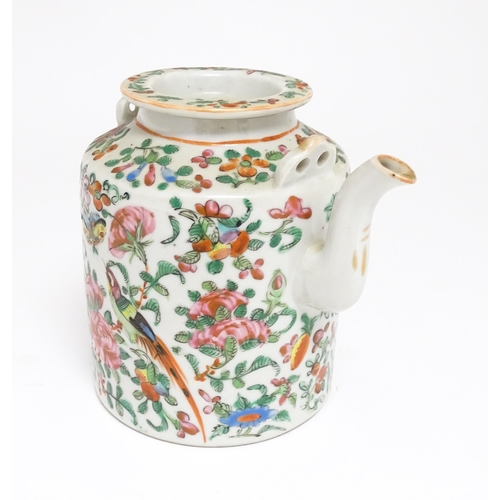 37A - A Chinese Cantonese famille rose teapot decorated with flowers, foliage, birds and butterflies. Appr... 