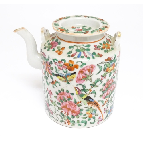 37A - A Chinese Cantonese famille rose teapot decorated with flowers, foliage, birds and butterflies. Appr... 