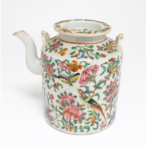 37A - A Chinese Cantonese famille rose teapot decorated with flowers, foliage, birds and butterflies. Appr... 