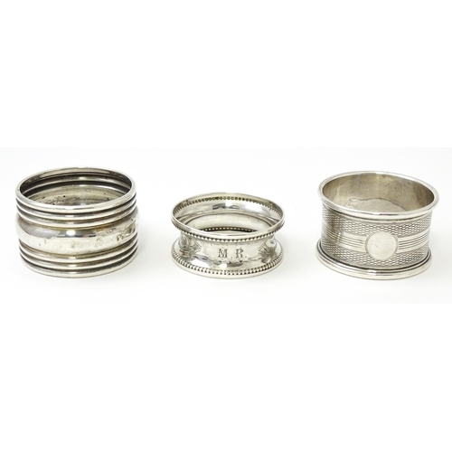 365 - Three various silver napkin rings to include one with engine turned decoration hallmarked Birmingham... 