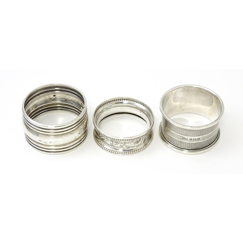 365 - Three various silver napkin rings to include one with engine turned decoration hallmarked Birmingham... 