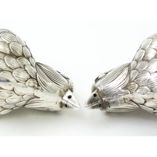 436 - A pair of novelty silver plate salts / peppers of bird form. Approx. 2